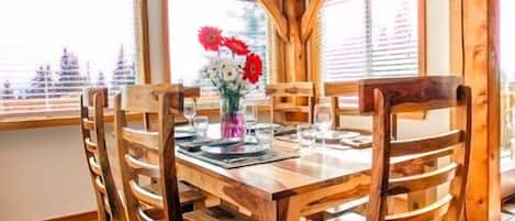 Dining Area with surrounding views to meadows, forest and mountains!