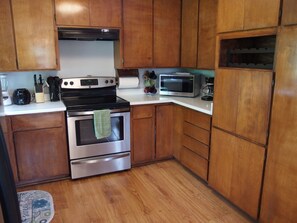 Fully stocked kitchen with all the appliances you need and plenty of cupboards