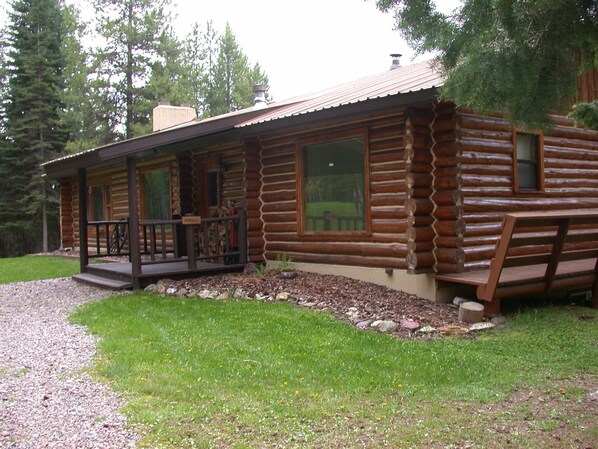 As you arrive at the Elk Antler Cabin, a log house with 3000 sq ft of space.