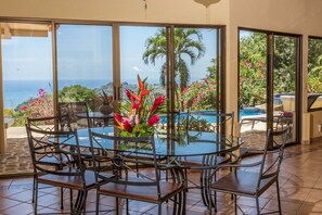 View from dining area to pool patio and Pacific Ocean
