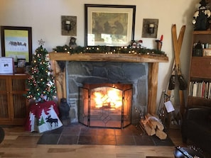 Stone fireplace. We deck the halls for you a bit for the holidays.  Come enjoy!