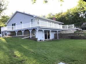 House with large wrap around deck.