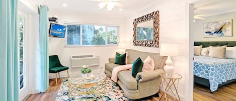 Living room with French doors and pool view, newly updated 