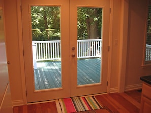 French doors open to the back deck.