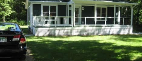 The property has a screened porch and firepit.