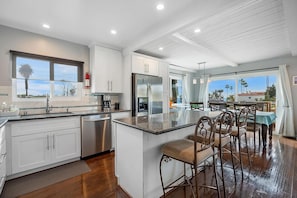 Kitchen, fully stocked, fridge, dishwasher, oven, gas range. Open concept