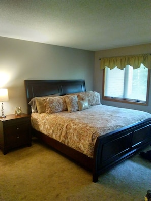 Master bedroom with king bed and private bath.