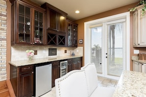 Custom bar with sink, wine cooler & soda refrigerator, Exit these doors and view