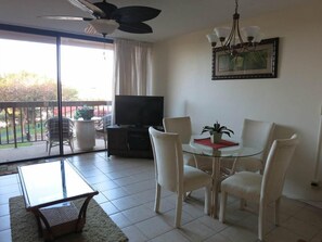 Dining area, flat screen TV with cable and DVD player, lanai with garden view