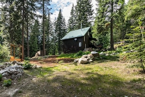 view of cabin from the lower part of property 