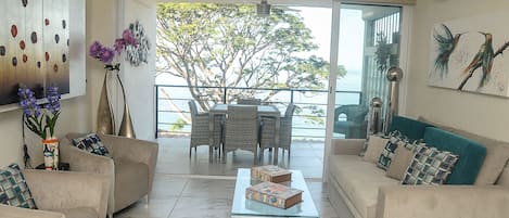 View of ocean with 10 story Jacaranda tree