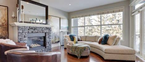 View of great room from the kitchen with balcony access 