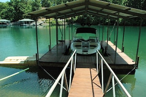 Dock for your boat & jetski.  Water is approximately 8 feet deep at end of dock.