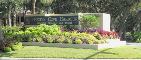 Beautifully landscaped entrance sign to Shelter Cove Harbor leading to Anchorage