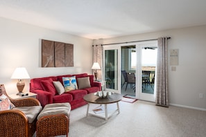 Sliders lead from the great room to the deck with amazing views!
