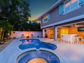 Beautifully lit PRIVATE backyard with solar torches, pool lighting, ambient lighting