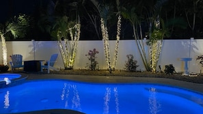 Completely Private Back Pool Area lights up Blue at night with solar LED white lights.