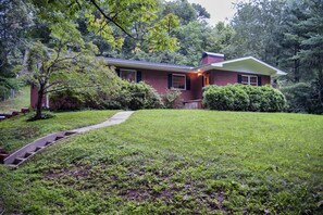 view of front - large front yard, woods in back