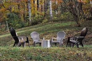 Outdoor fire pit and chairs in back yard