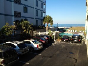 EXACT VIEW FROM OUR 2ND FLOOR BALCONY OVERLOOKING THE POOL AREA AND BEACH 