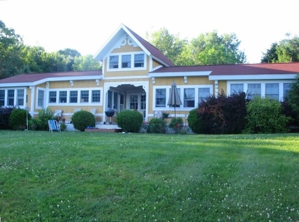 Back of Cottage with expansive lawn - all windows look out onto the ocean!