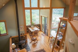 Loft ladder (to be used at your own risk) and the dining room, stove kitchen bar