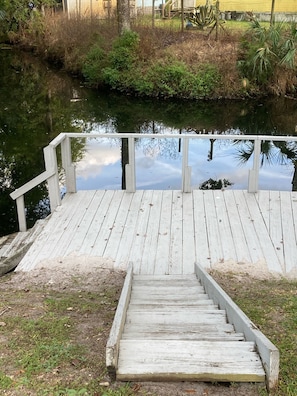 Dock on corner of lot at intersecting canals. Next to fire pit. 