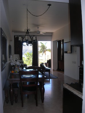 View of Dining Area & Living Room with Patio in Background.  Very Inviting!