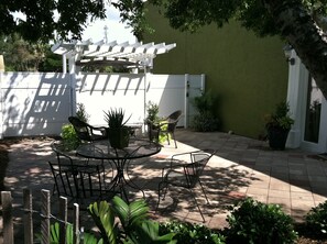 Enjoy a cup of coffee or a glass of wine in your private courtyard