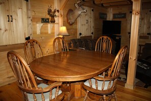 The dining area next to the kitchen seats six comfortably