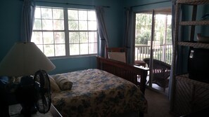 Master Bedroom looking out to Lanai and Pool area