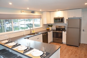 Newly remodeled kitchen with granite counters and beautiful views