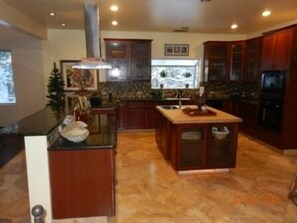 Chief's Kitchen w/ new stainless steel appliances, featuring 2-ovens, 2-fridges, 2-sinks, cooktop, dishwasher & microwave