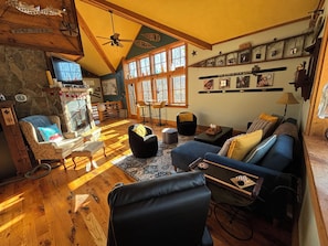 3rd floor open living space offers endless views and balcony for outdoor access