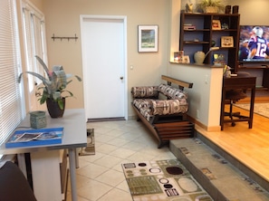 Comfortable sitting area that's part of the sunroom.