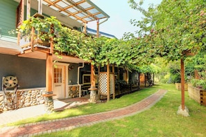 Front door access through grapevine arch.