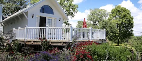 Mallard Cottage is surrounded by flower gardens and wild life.