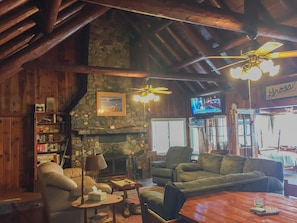 Great room with floor to ceiling stone fireplace