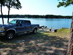 A large concrete boat ramp & a circular drive makes it easy to launch your boat.