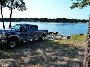 A large concrete boat ramp & a circular drive makes it easy to launch your boat.