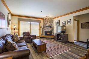 Living area with gas fire place and 52" with smart TV options