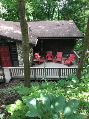 Spend time on a relaxing deck. A picnic table is available for your use as well