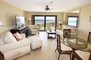 Living room area has two comfortable chairs and sleeper sofa.