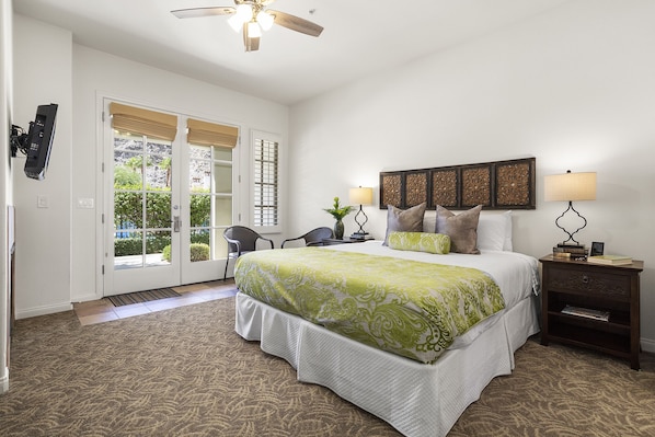 Main Bedroom with un-suite & coffee bar. King bed, closet, dresser & smart TV.  