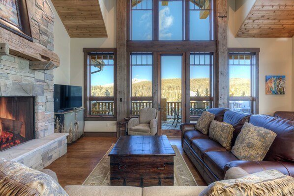 The Great Room with commanding views and beautiful stone fire place