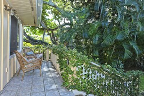 Tropical Setting of Front Porch Overlooking Monkey Pod Tree