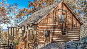 Genuine hand-hewn log cabin. Beautiful hand carved details.