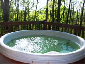 Hot tub on deck with amazing view...view varies due to foliage.