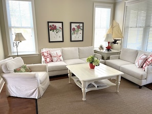The living room is spacious and lots of light to read and enjoy.