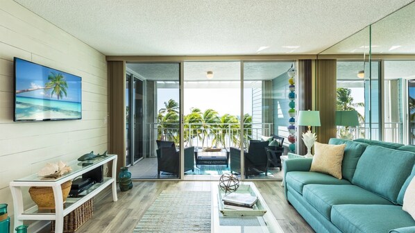 Spacious open style living room with ocean view.